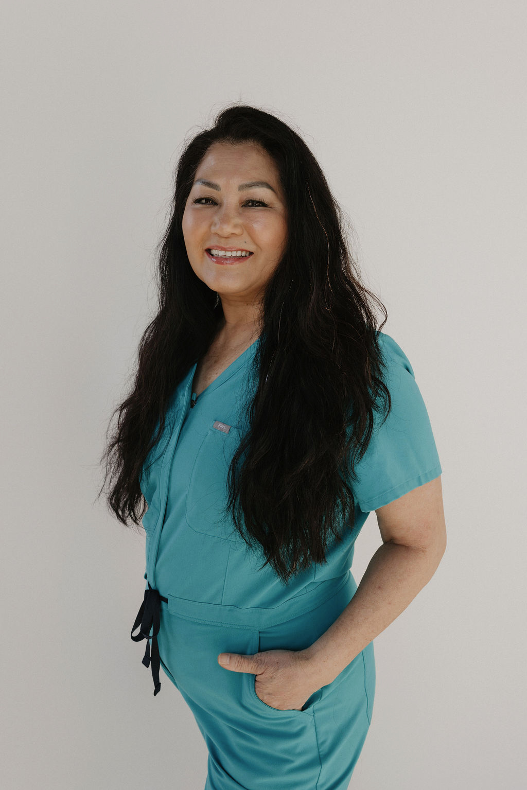Thuy giving a facial to a client